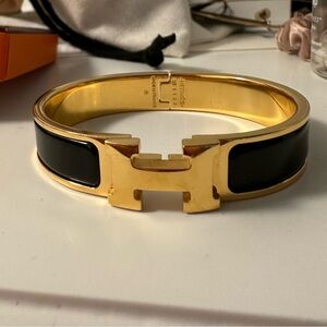 Hermes black and gold clic h bracelet